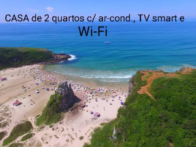 CASA completa em TORRES-RS - O MELHOR CUSTO BENEFICIO na mais bela praia Gaúcha - Cozinha - Banheiro - Ar condicionado - Smart TV 32 Android Apps Youtube - Netflix - Prime Vídeo e Wi-Fi - Estacionamento - Acomoda até 10 pessoas - Anfitriã Superhost n Vila Exterior foto