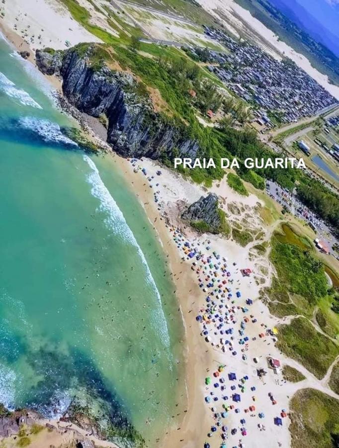CASA completa em TORRES-RS - O MELHOR CUSTO BENEFICIO na mais bela praia Gaúcha - Cozinha - Banheiro - Ar condicionado - Smart TV 32 Android Apps Youtube - Netflix - Prime Vídeo e Wi-Fi - Estacionamento - Acomoda até 10 pessoas - Anfitriã Superhost n Vila Exterior foto