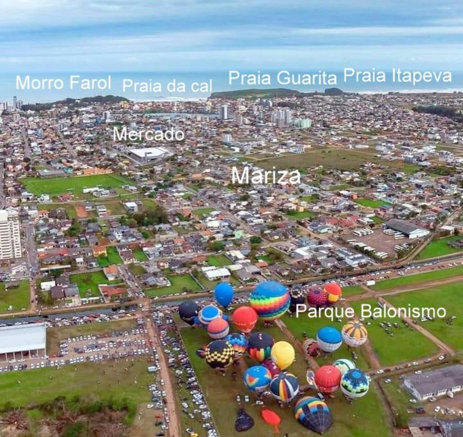 CASA completa em TORRES-RS - O MELHOR CUSTO BENEFICIO na mais bela praia Gaúcha - Cozinha - Banheiro - Ar condicionado - Smart TV 32 Android Apps Youtube - Netflix - Prime Vídeo e Wi-Fi - Estacionamento - Acomoda até 10 pessoas - Anfitriã Superhost n Vila Exterior foto